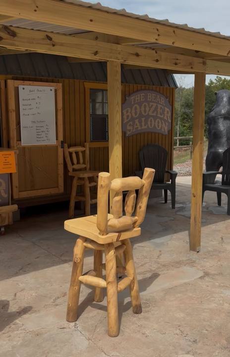 Log bar stools on a covered porch