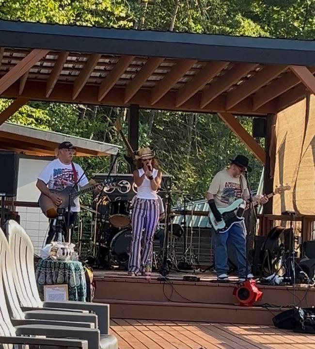 A band playing on the covered wooden stage, Adirondack chairs out front